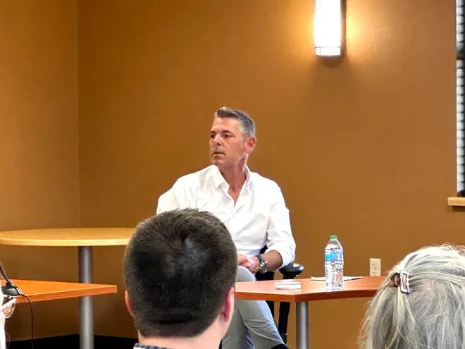 Aaron Bilyeu, Chief Development Officer at Cloverleaf Infrastructure, speaking at a public meeting.