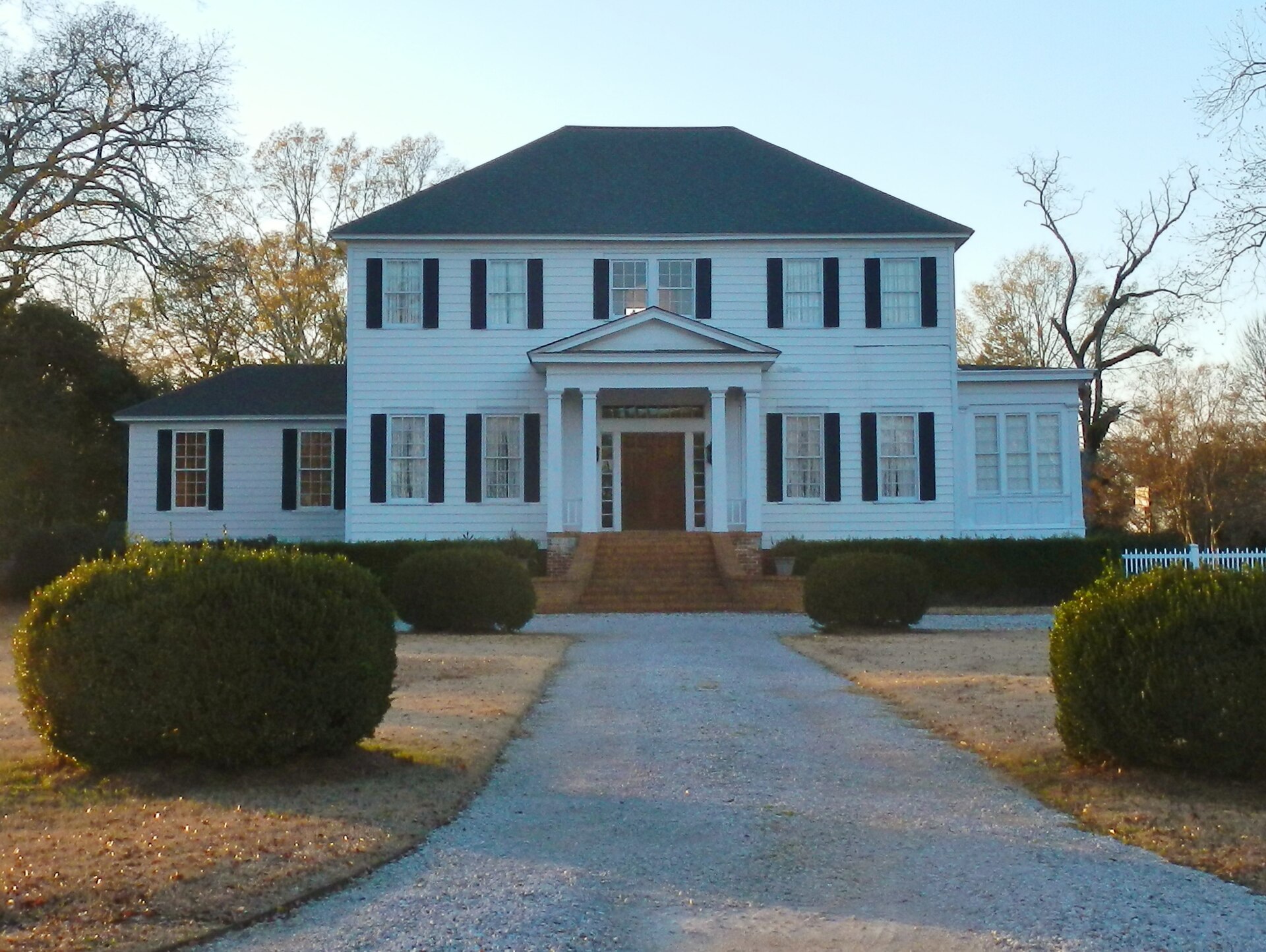 The Holly House (1836) in the Lowndesboro Historic District — one of many antebellum homes that define the character of the neighborhood Project Red Clay would border.